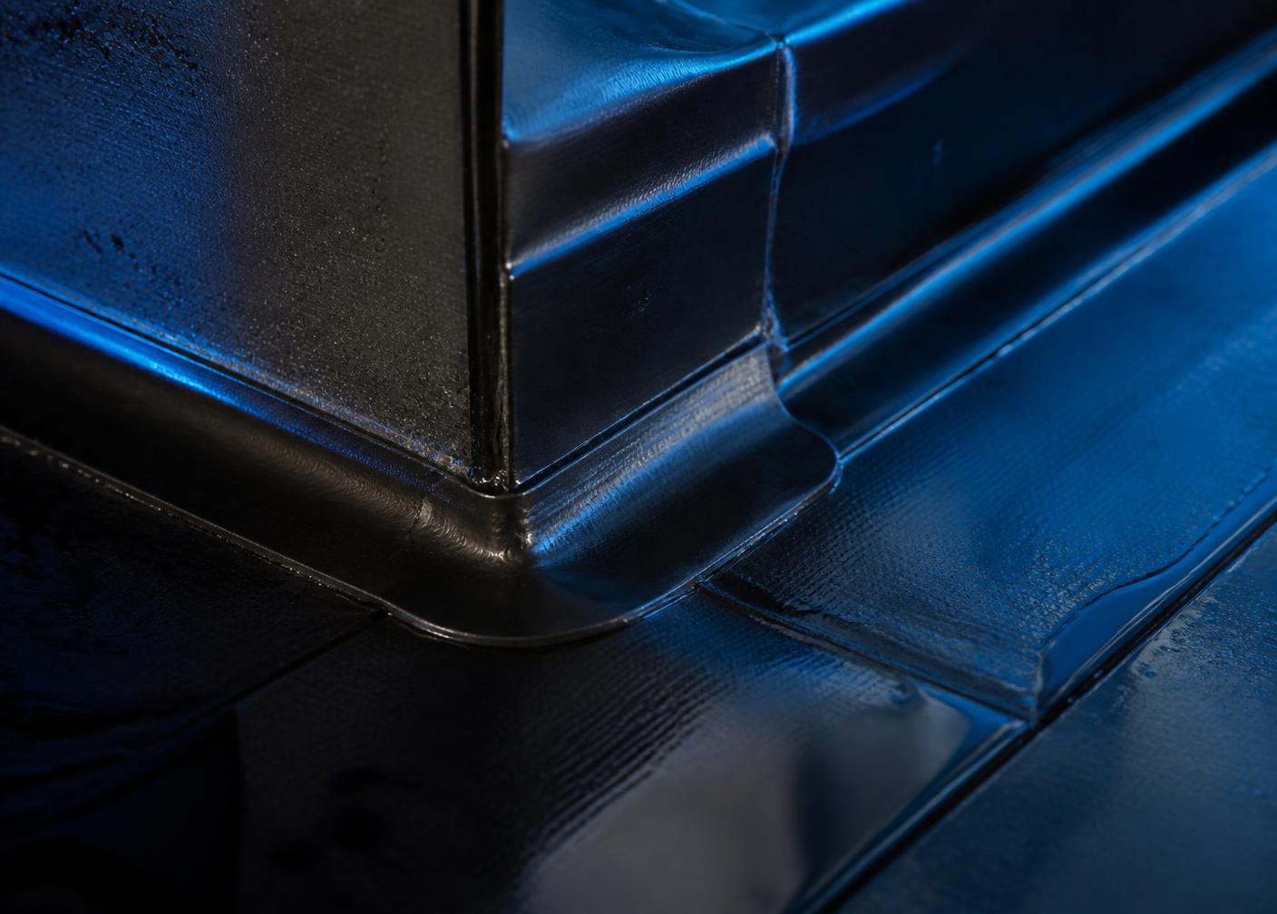 Macro detail of a commercial roof seam and flashing